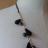 Sautoir ruban,perles et pampilles noires.