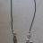 Collier perles et pendentifs m�tal et strass.